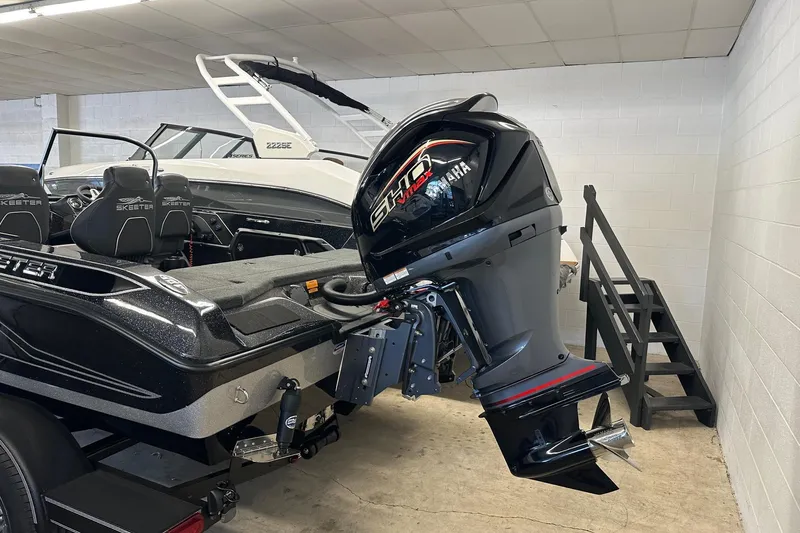 Slide: The Image of 2026 Skeeter WX1910 boat with Yamaha outboard motor in showroom. - 10