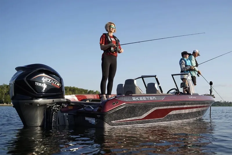 Slide: The Image of 2026 Skeeter WX1910 boat interior with cushioned seating and storage compartments. - 3