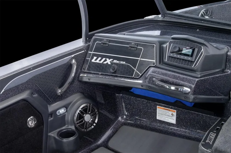 Slide: The Image of Manufacturer Provided Image: 2026 Skeeter WX1910 boat interior with cushioned seats and storage compartment. - 6