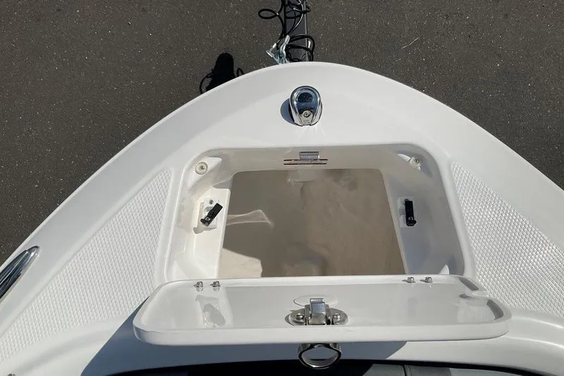 Slide: The Image of Bow storage compartment of 2026 Chaparral 21 SSi OB boat, featuring sleek design and latch. - 10