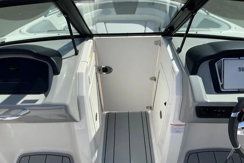 Slide: The Image of Interior view of 2026 Chaparral 21 SSi OB boat cockpit with modern design. - 13