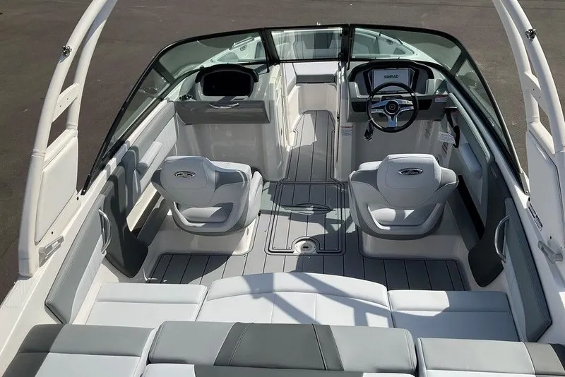 Slide: The Image of 2026 Chaparral 21 SSi OB boat interior with sleek seating and modern dashboard design. - 24