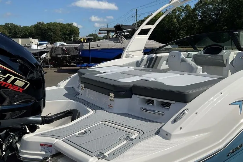 Slide: The Image of 2026 Chaparral 21 SSi OB boat with sleek design and powerful outboard engine. - 26