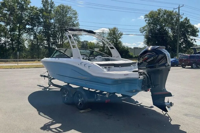 Slide: The Image of 2026 Chaparral 21 SSi OB boat on trailer, parked outdoors, sunny day. - 28