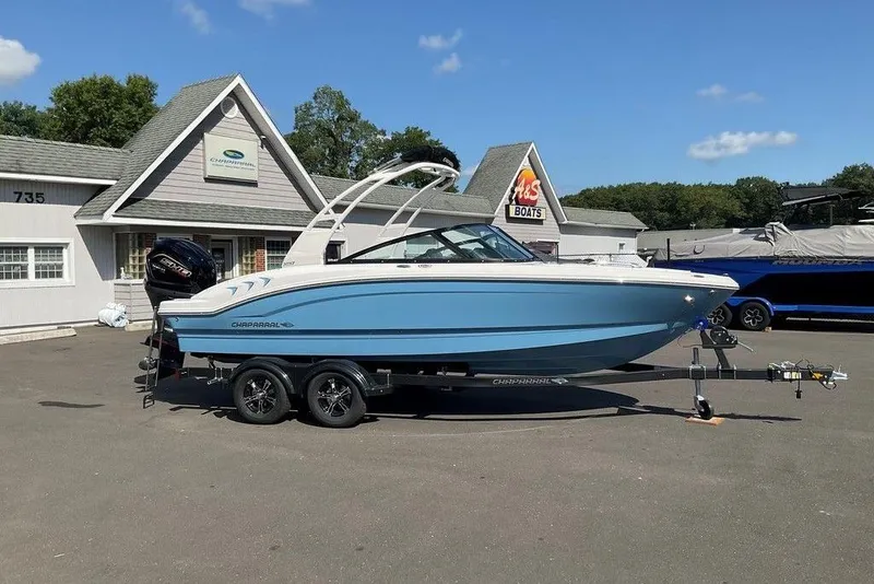 Slide: The Image of 2026 Chaparral 21 SSi OB boat on trailer, parked outside dealership. - 29