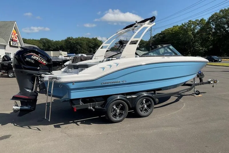 Slide: The Image of 2026 Chaparral 21 SSi OB boat with Yamaha engine on trailer, parked outdoors. - 33