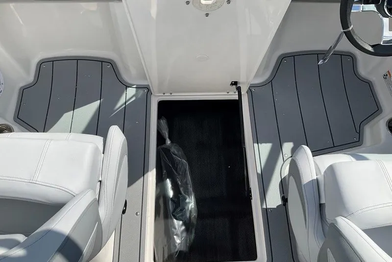 Slide: The Image of 2026 Chaparral 21 SSi OB boat interior with gray flooring and white seating. - 5