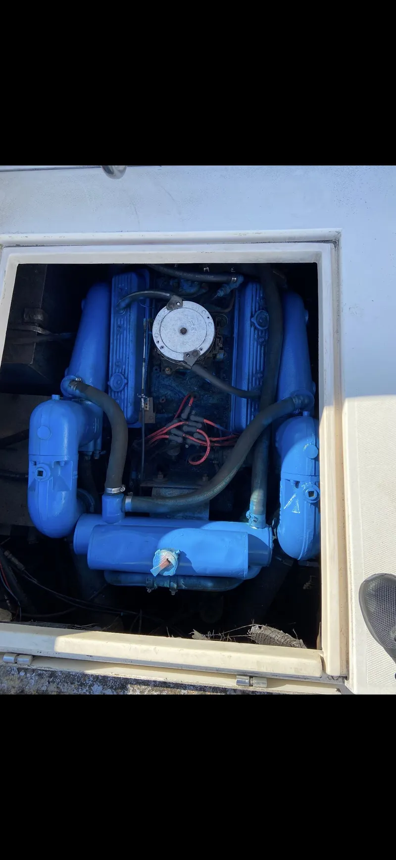 Slide: The Image of Engine compartment of a 1987 Phoenix 29 Convertible boat. - 16