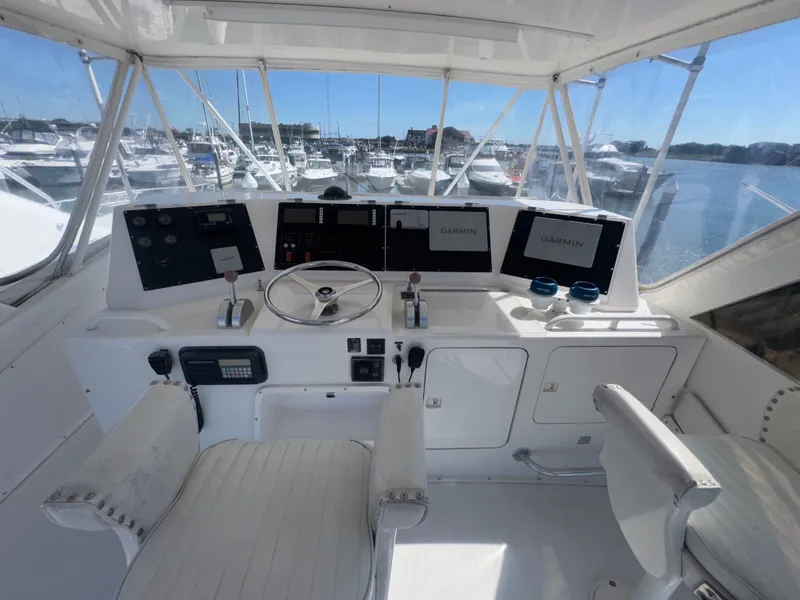 Slide: The Image of Helm of 1995 Bertram 50 Convertible yacht with Garmin navigation displays. - 11