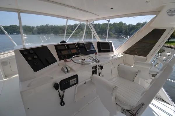 Slide: The Image of 1995 Bertram 50 Convertible yacht cockpit with steering wheel and navigation equipment. - 12