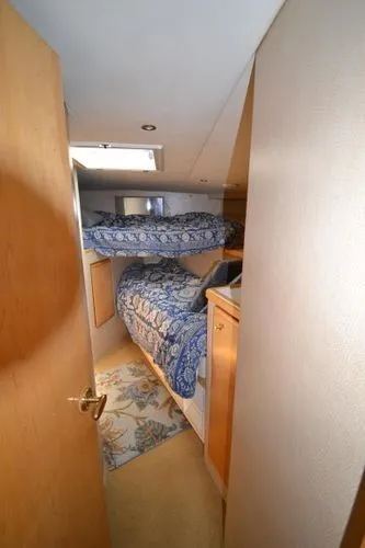 Slide: The Image of Interior cabin of a 1995 Bertram 50 Convertible yacht with bunk beds. - 34