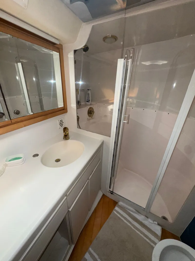 Slide: The Image of Bathroom interior of 1995 Bertram 50 Convertible yacht with shower and sink. - 37