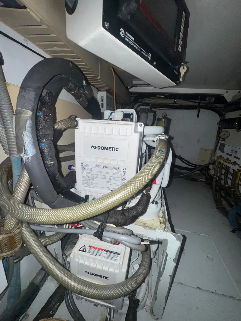 Slide: The Image of Engine room of 1995 Bertram 50 Convertible with Dometic equipment and wiring. - 44