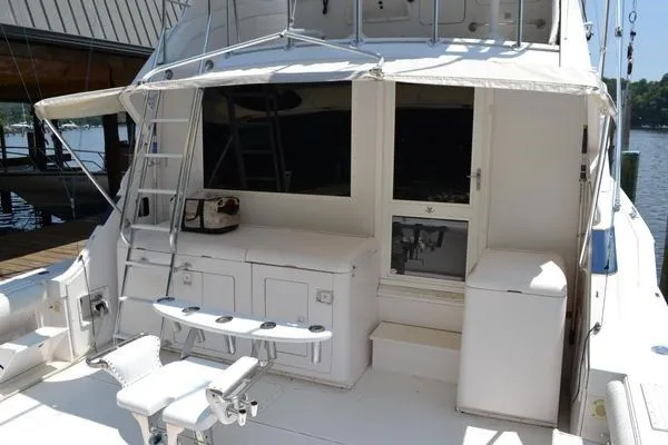 Slide: The Image of 1995 Bertram 50 Convertible yacht with spacious deck and fishing chair. - 5