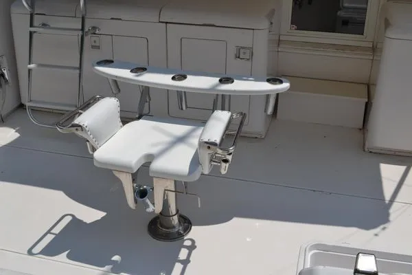 Slide: The Image of Fishing chair on 1995 Bertram 50 Convertible yacht deck with rod holders. - 8
