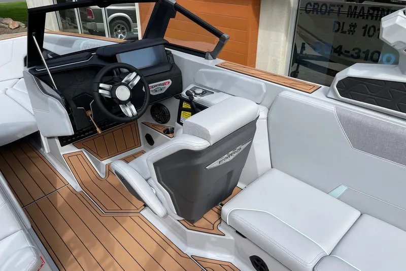 Slide: The Image of 2026 Nautique Super Air Nautique GS24 interior with sleek design and modern dashboard. - 6
