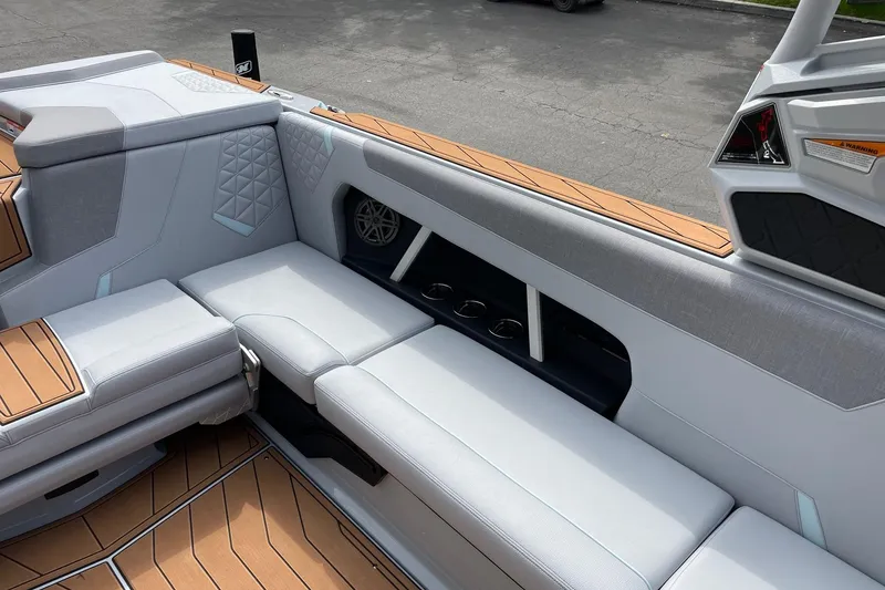 Slide: The Image of 2026 Nautique Super Air Nautique GS24 interior with sleek seating and modern design. - 9