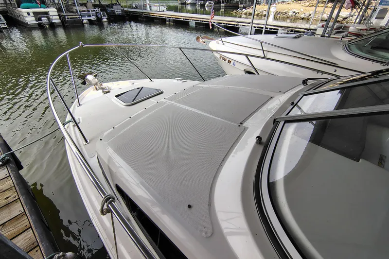 Slide: The Image of 2008 Regal 2565 Window Express boat docked at marina, side view. - 5
