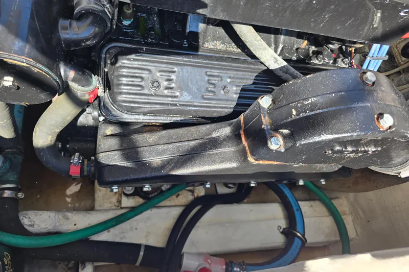 Slide: The Image of Engine compartment of a 1984 Bayliner 2802 Trophy boat, showing hoses and components. - 12