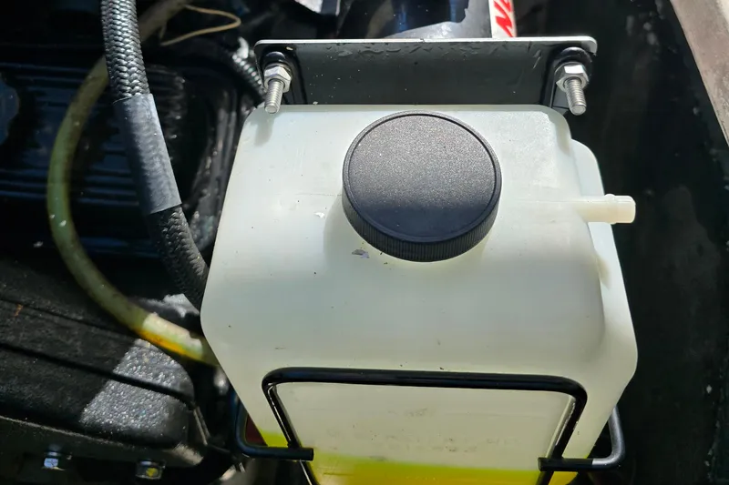 Slide: The Image of Engine compartment of 1984 Bayliner 2802 Trophy with coolant reservoir. - 15