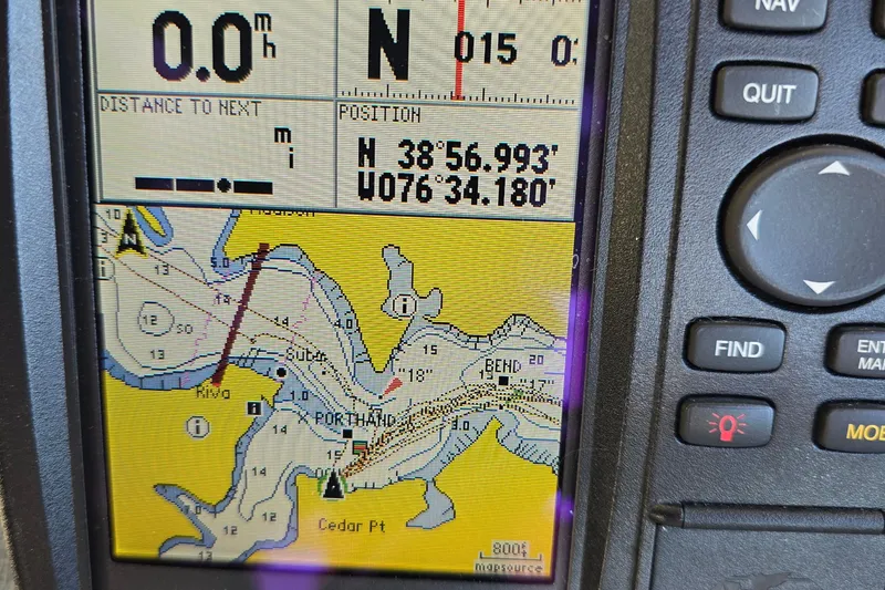 Slide: The Image of GPS navigation screen on a 1984 Bayliner 2802 Trophy boat, showing coordinates and map. - 24