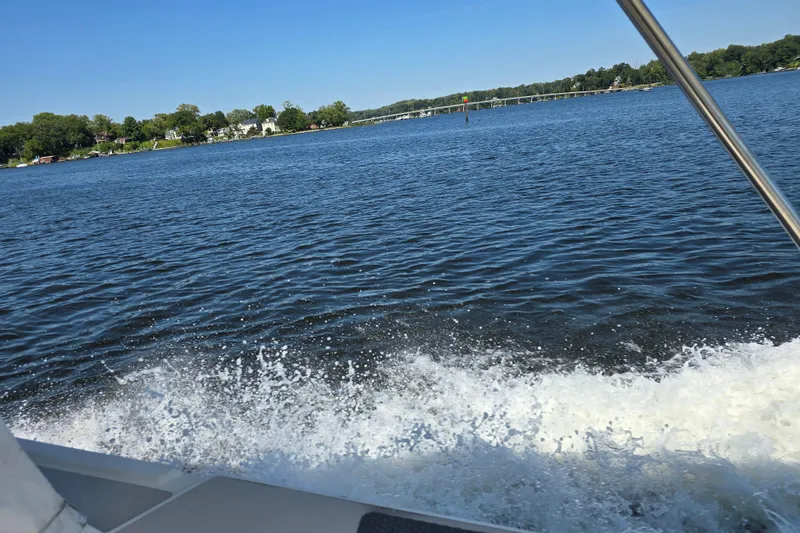 Slide: The Image of Bayliner 2802 Trophy boat cruising on a scenic lake, 1984 model. - 27