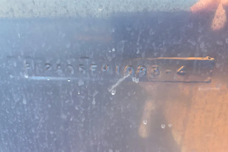 Slide: The Image of Close-up of the hull identification number on a 1984 Bayliner 2802 Trophy boat. - 4