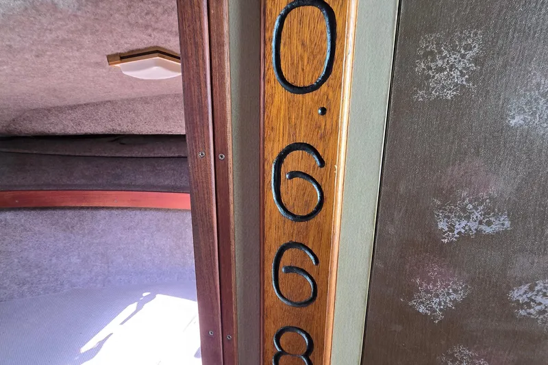 Slide: The Image of Interior of 1984 Bayliner 2802 Trophy boat with wood paneling and cabin details. - 40