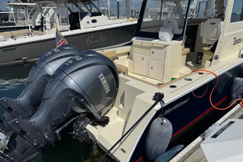 Slide: The Image of 2026 NorthCoast 285 HT boat with twin Yamaha engines docked at marina. - 10
