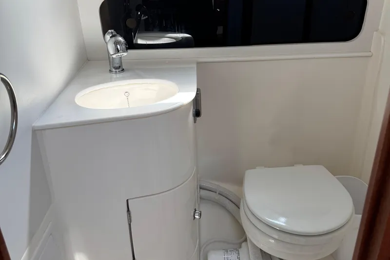 Slide: The Image of Modern bathroom in 2026 NorthCoast 285 HT boat, featuring sink and toilet. - 26
