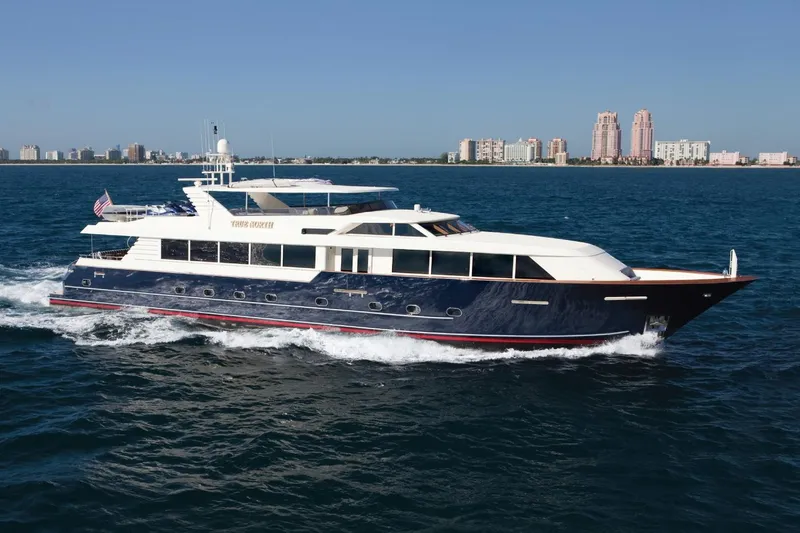Slide: The Image of Luxury 2000 Broward Raised Pilothouse yacht cruising on open water. - 0