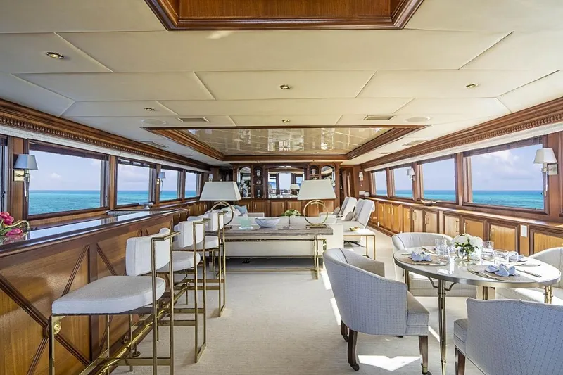 Slide: The Image of Luxurious interior of 2000 Broward Raised Pilothouse yacht with ocean views and elegant furnishings. - 1