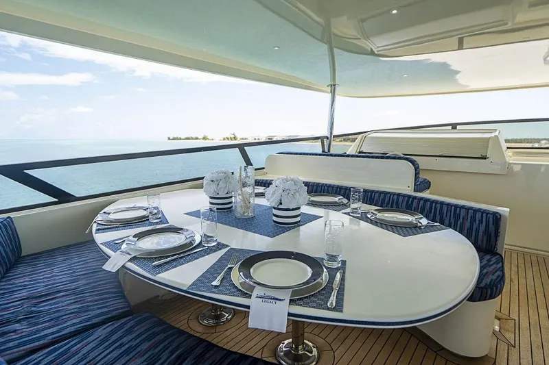 Slide: The Image of Luxurious dining area on 2000 Broward Raised Pilothouse yacht with ocean view. - 23