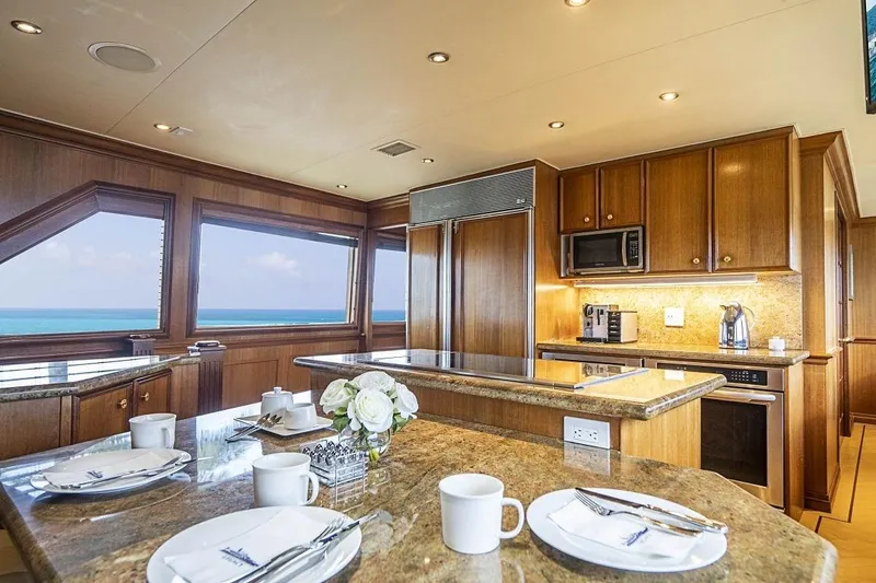 Slide: The Image of Luxurious kitchen interior of 2000 Broward Raised Pilothouse yacht with ocean view. - 8