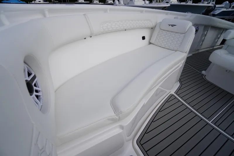 Slide: The Image of 2026 Tidewater 282 CC Adventure boat interior with white seating and sleek design. - 14