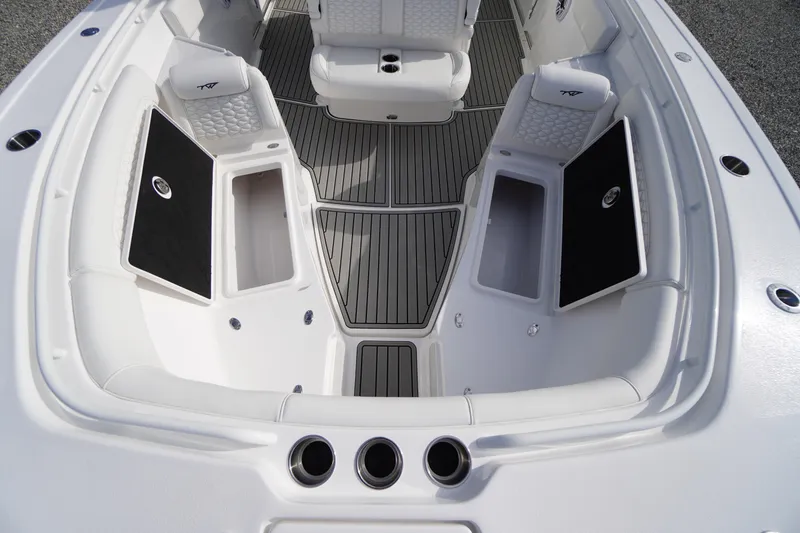 Slide: The Image of 2026 Tidewater 282 CC Adventure boat interior with seating and storage compartments. - 15