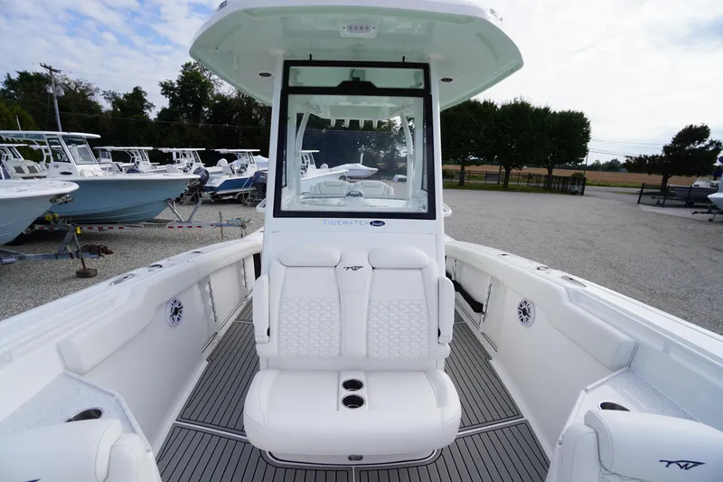 Slide: The Image of 2026 Tidewater 282 CC Adventure boat interior with white seating and modern design. - 20