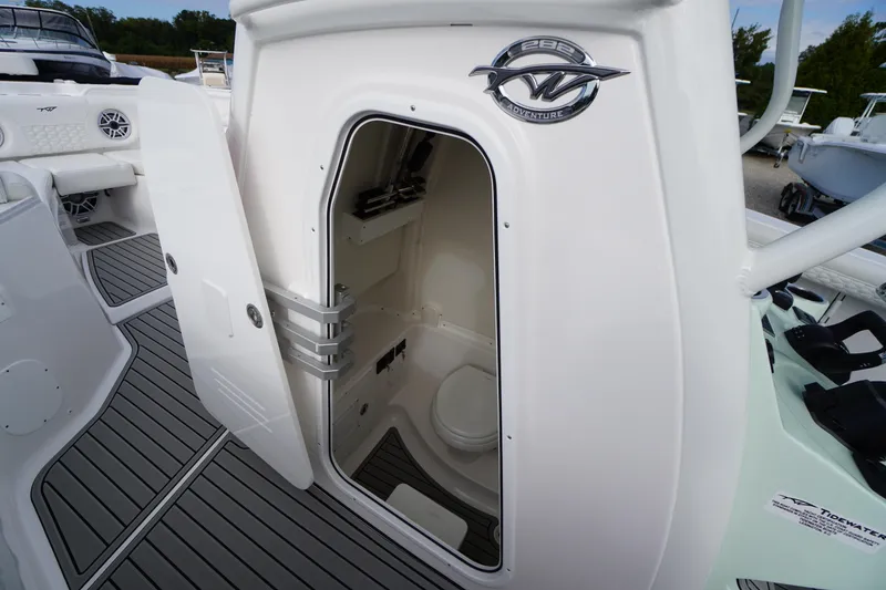 Slide: The Image of 2026 Tidewater 282 CC Adventure boat interior with open cabin door. - 24