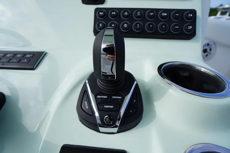 Slide: The Image of Close-up of 2026 Tidewater 282 CC Adventure boat control panel with joystick and buttons. - 36