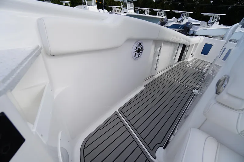 Slide: The Image of 2026 Tidewater 282 CC Adventure boat interior with sleek deck and modern design. - 39