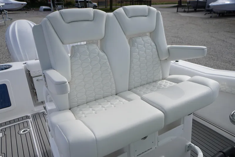 Slide: The Image of Luxurious seating on 2026 Tidewater 282 CC Adventure boat, featuring elegant white upholstery. - 43