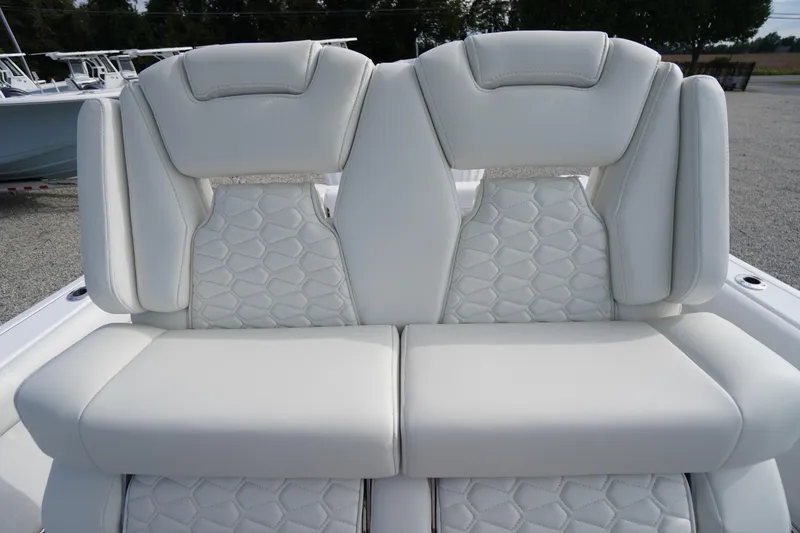 Slide: The Image of 2026 Tidewater 282 CC Adventure boat with luxurious white seating and modern design. - 45