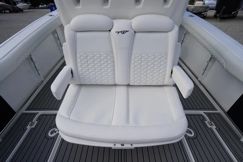 Slide: The Image of 2026 Tidewater 282 CC Adventure boat with luxurious white seating and armrests. - 57