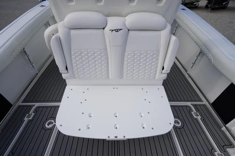 Slide: The Image of 2026 Tidewater 282 CC Adventure boat seating with quilted upholstery and sleek deck design. - 58