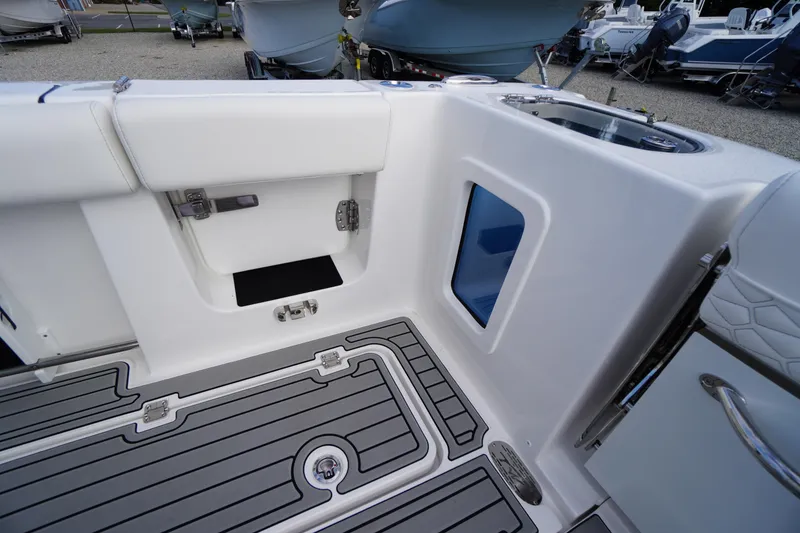 Slide: The Image of 2026 Tidewater 282 CC Adventure boat interior with sleek seating and modern flooring design. - 65