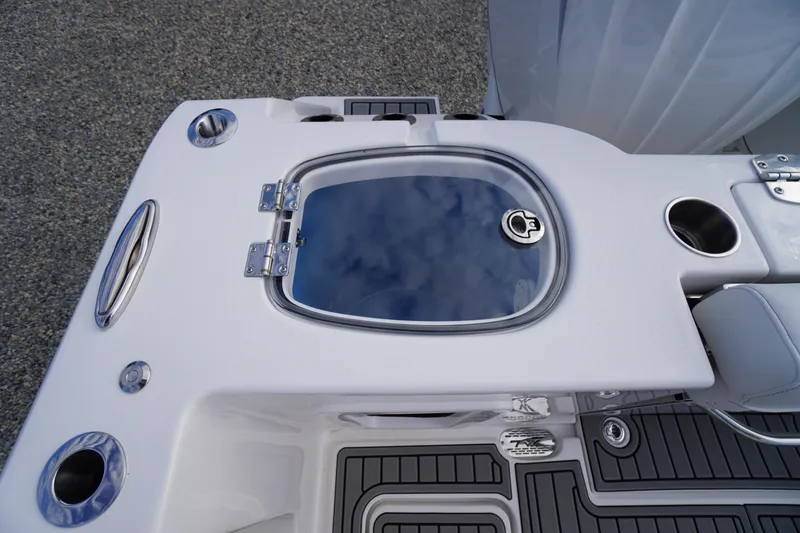 Slide: The Image of 2026 Tidewater 282 CC Adventure boat deck with livewell and cup holders. - 66