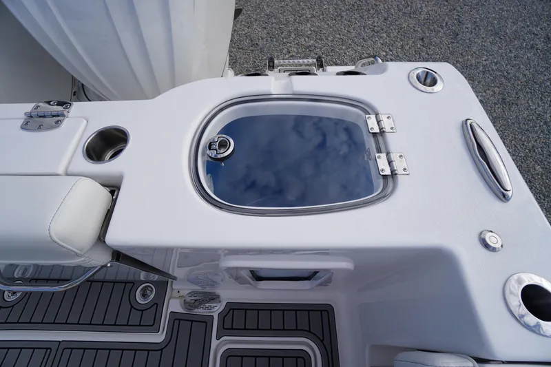 Slide: The Image of 2026 Tidewater 282 CC Adventure boat deck with livewell and seating area. - 68