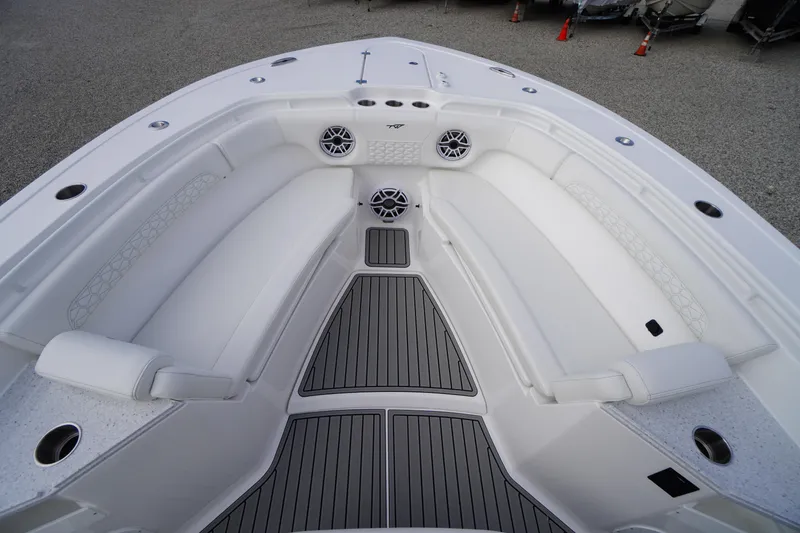 Slide: The Image of 2026 Tidewater 282 CC Adventure boat interior with white seating and modern design. - 7