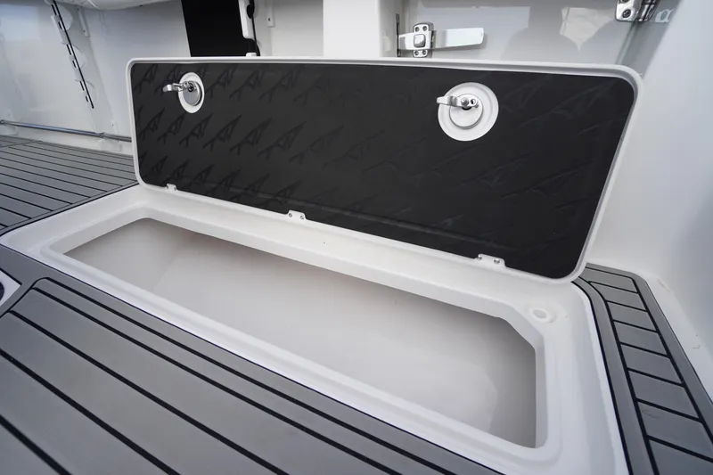 Slide: The Image of Open storage compartment on 2026 Tidewater 282 CC Adventure boat deck. - 78
