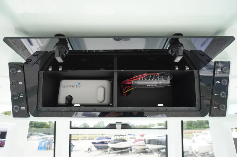 Slide: The Image of 2026 Tidewater 282 CC Adventure boat console with Garmin device and wiring. - 84